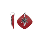 Bold sterling silver palm tree pendant set on red coral diamond base, artisan-crafted for tropical statement style.